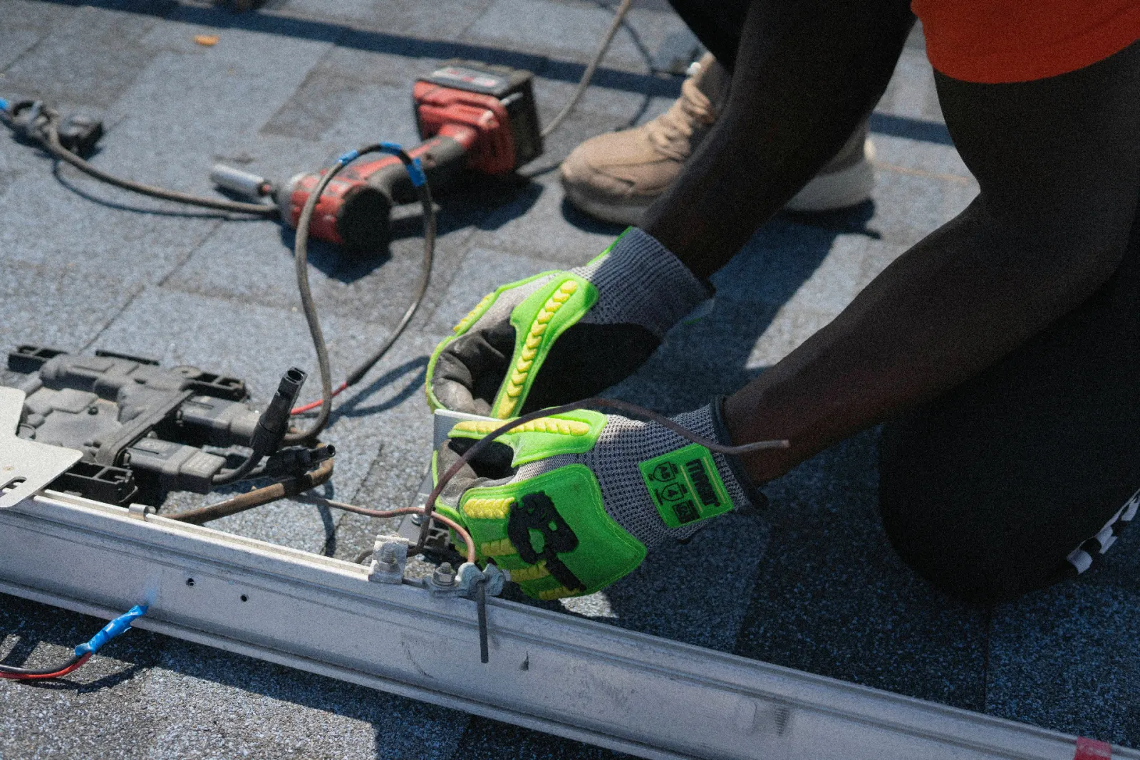 Ontario solar technician re-terminating MC4 connectors on a rooftop PV module